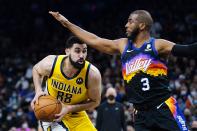 Indiana Pacers center Goga Bitadze (88) pauses before going up to shoot against Phoenix Suns guard Chris Paul (3) during the first half of an NBA basketball game Saturday, Jan. 22, 2022, in Phoenix. (AP Photo/Ross D. Franklin)