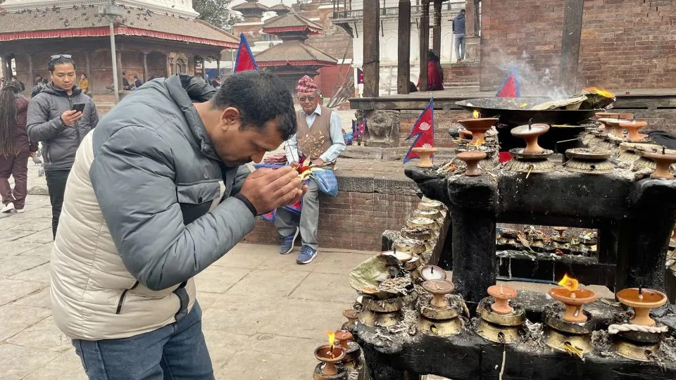 Ramchandra Khadka prays outside a temple in Kathmandu for his comrades fighting for Russia. - CNN