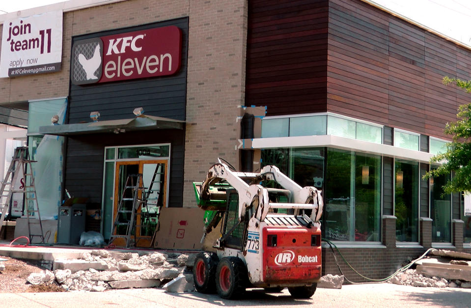 <p> A KFC restaurant that is remodeled on Wednesday, July 17, 2013, in Louisville, Ky. The KFC restaurant is a new test restaurant, called "KFC eleven" and the sign will include no pictures of Colonel Sanders. It will serve flatbread sandwiches, rice bowls and boneless chicken. (AP Photos/Dylan Lovan)</p>