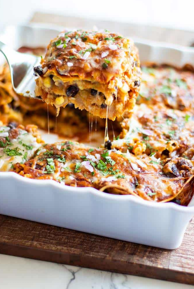 <p><a href="https://sunkissedkitchen.com/vegetarian-enchilada-casserole-recipe/" rel="nofollow noopener" target="_blank" data-ylk="slk:Sunkissed Kitchen;elm:context_link;itc:0;sec:content-canvas" class="link ">Sunkissed Kitchen</a></p>