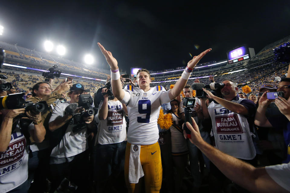 FILE - In this Nov. 30, 2019, file photo, LSU quarterback Joe Burrow (9) gestures thanks to the student section after playing his last game in Tiger Stadium, an NCAA college football game against Texas A&M, in Baton Rouge, La. LSU quarterback Joe Burrow is The Associated Press college football player of the year in a landslide vote. Burrow, who has led the top-ranked Tigers to an unbeaten season and their first College Football Playoff appearance, received 50 of 53 first-place votes from AP Top 25 poll voters and a total of 156 points. (AP Photo/Gerald Herbert, File)