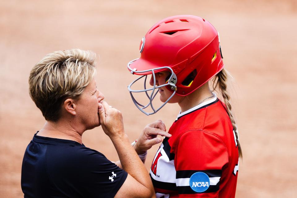 Utah head coach Amy Hogue talks to Utah catcher Kendall Lundberg (32) during the third game of the NCAA softball Super Regional between Utah and San Diego State at Dumke Family Softball Stadium in Salt Lake City on Sunday, May 28, 2023. | Ryan Sun, Deseret News