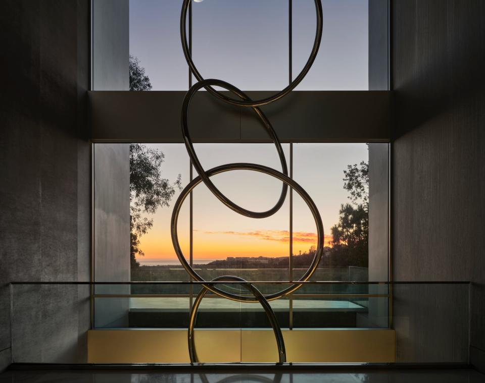 decorative rings and a window overlooking the ocean in mansion The One Bel Air