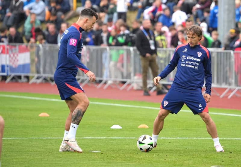 Croatia's Luka Modric (R) and Ivan Perisic  take part in a training session for the team at the Volksparkstadion as part of their preparations for the UEFA EURO 2024. Soeren Stache/dpa