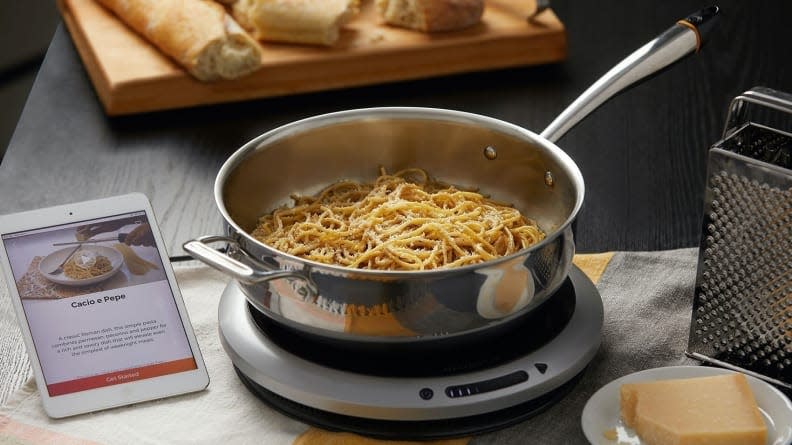 This smart induction cooktop walks you through each recipe, automatically adjusting its own temperature.