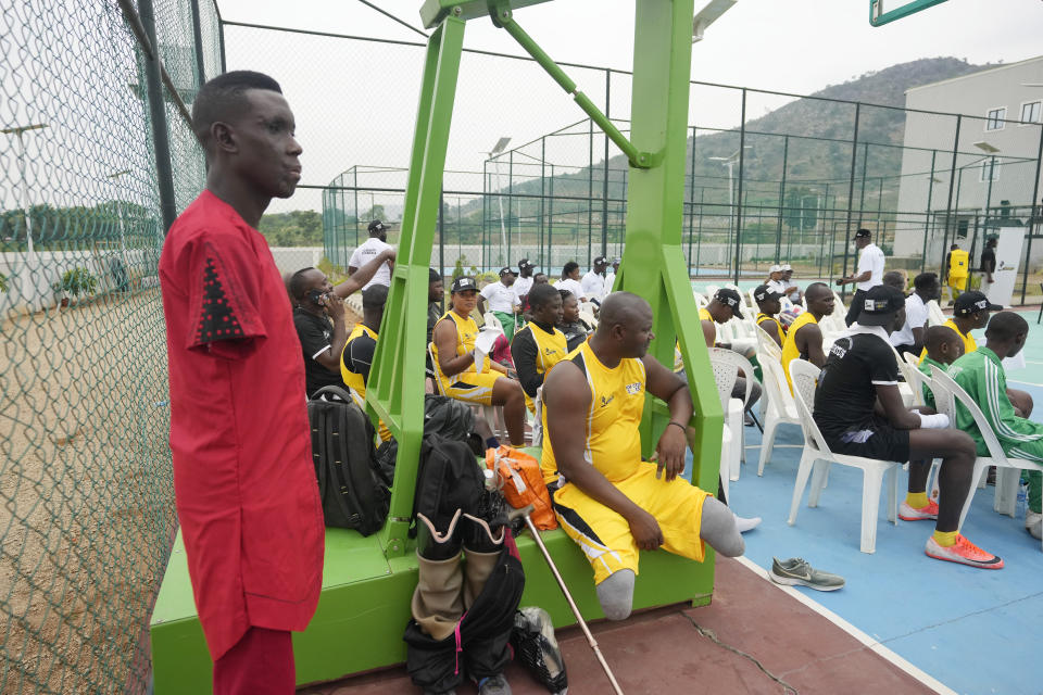 Lance Corporal, Dean Onuwchekwa, an Explosive Ordnance Disposal (EOD) specialist whose upper half body was damaged in 2021 by an improvised explosive device he was trying to disarm in Borno state's attends an exhibition sitting volleyball match in Abuja Nigeria, Saturday, May 11, 2024. (AP Photo/Sunday Alamba)