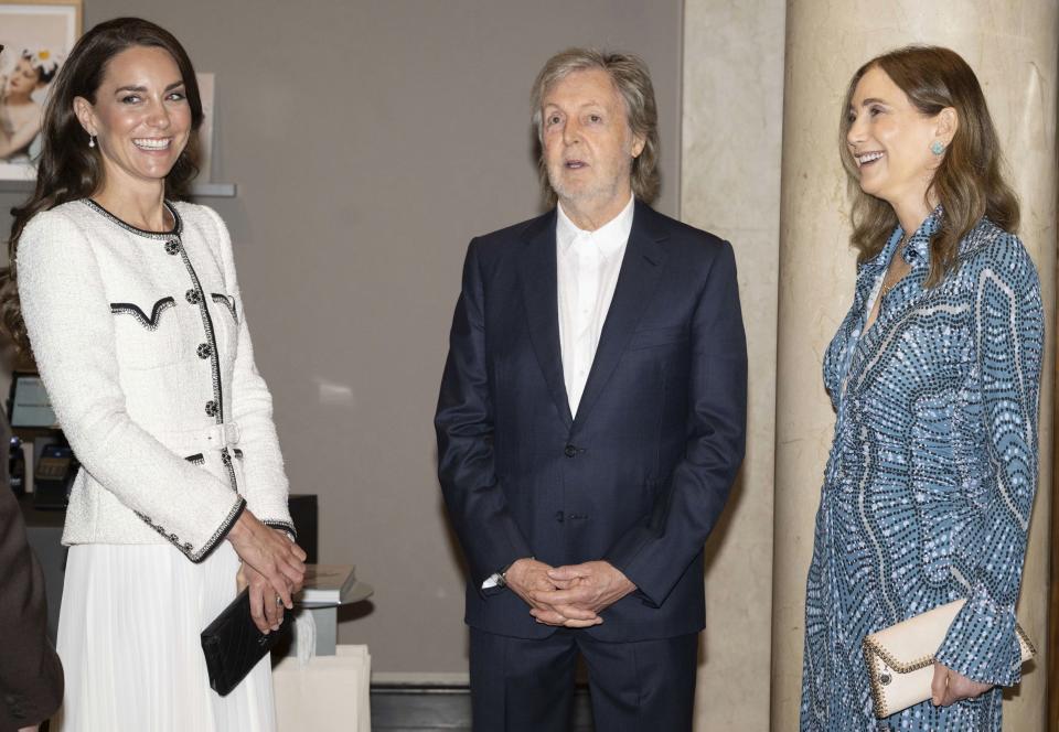 Britain's Kate, Princess of Wales with Sir Paul McCartney, second right, and his wife Nancy Shevell, right, during a visit to re-open the National Portrait Gallery in London Tuesday June 20, 2023, following a three-year refurbishment programme. The gallery has undergone a major transformation since closing its doors in March 2020, the biggest since the building opened 127 years ago. (Paul Grover, Pool Photo via AP)