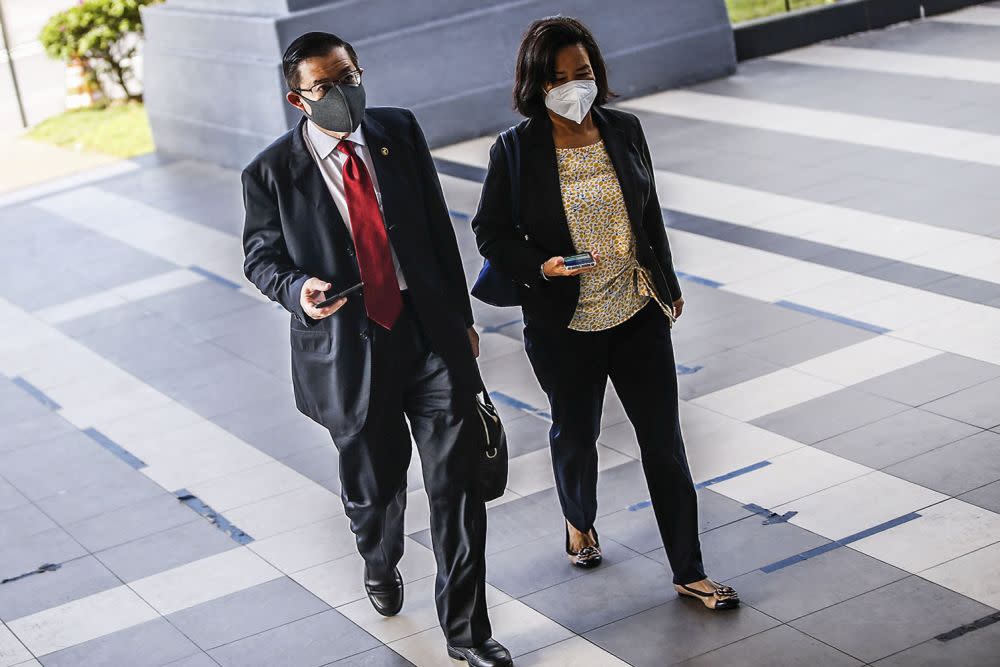 Former Penang chief minister Lim Guan Eng (left) and his wife Betty Chew Gek Cheng arrive at the Kuala Lumpur High Court September 23, 2021. — Picture by Hari Anggara