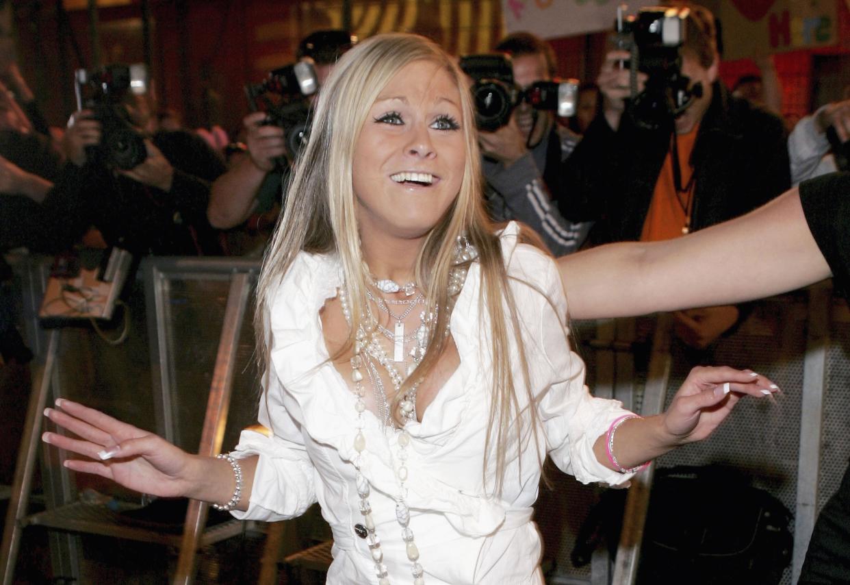 LONDON - JULY 14:  Nikki Grahame poses for photographers after being the  eighth person to be evicted from the Big Brother Seven House on July 14, 2006 in Borehamwood, England.   (Photo by MJ Kim/Getty Images)