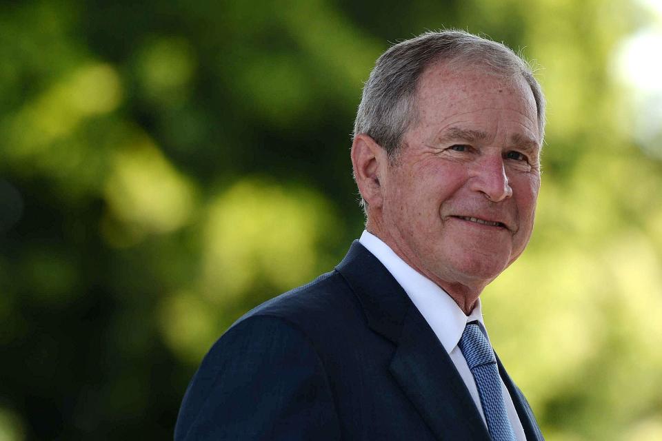 (FILES) In this file photo former United States of America President George W. Bush looks on upon his arrival at the Theresanyo Primary school, on April 4, 2017, in Gaborone, during a two day official visit in Botswana. - Republican former US president George W. Bush will attend the inauguration of Democrats Joe Biden and Kamala Harris in Washington on January 20, his chief of staff said Tuesday. 