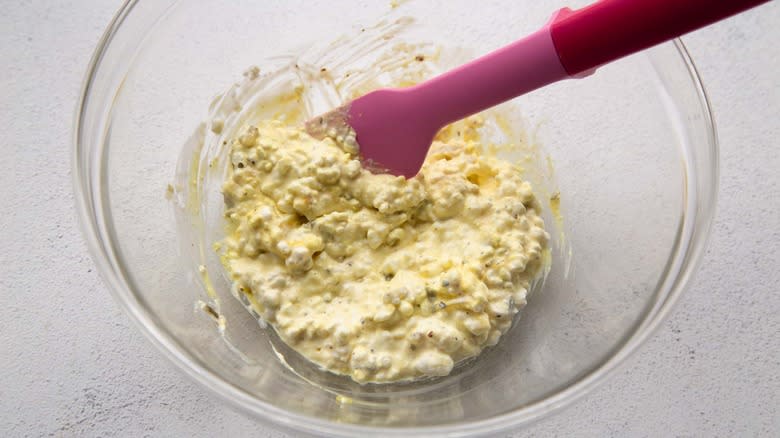 stirring cottage cheese mixture