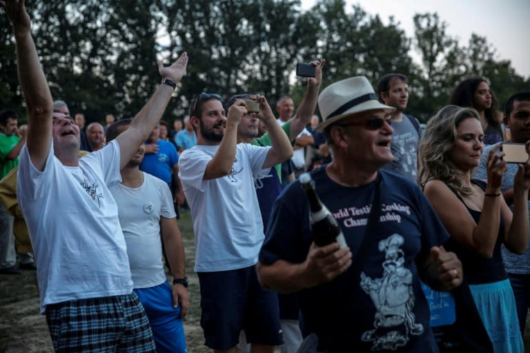 The crowd react at the announcement of the results of the 15th annual 'World Testicle Cooking Championship' in the village of Lipovica, Serbia on September 1, 2018