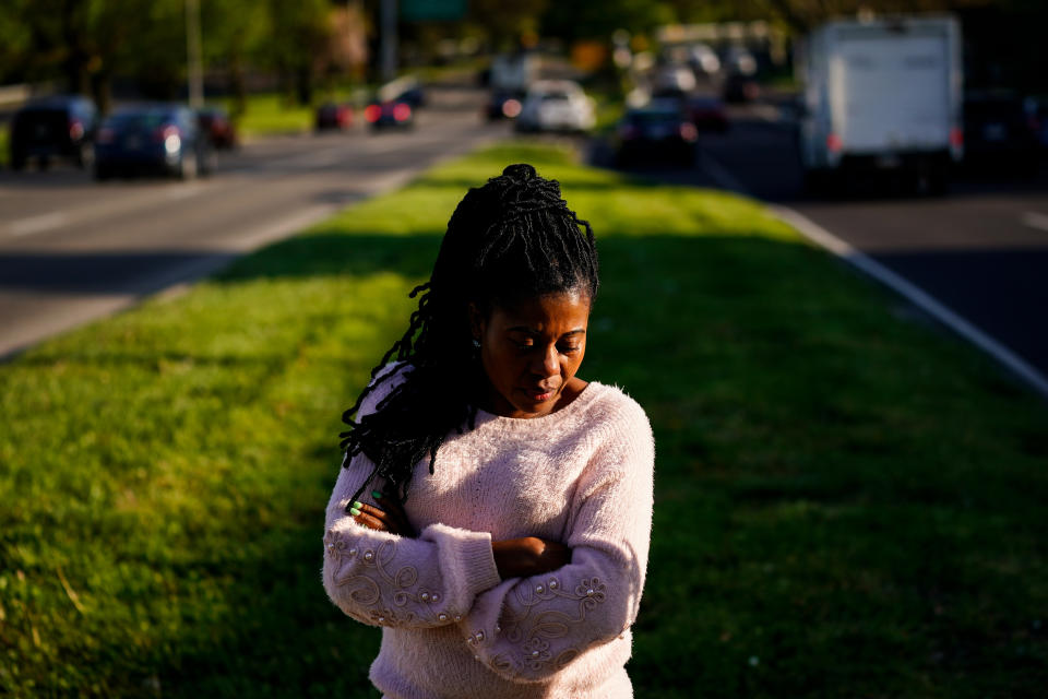 Eva Gbaa poses for a photograph at the site of where her 17-year-old nephew John "JJ" Gbaa Jr. was killed in a November 2018 hit-and-run as he tried to cross Roosevelt, in Philadelphia, Friday, April 29, 2022. (AP Photo/Matt Rourke)