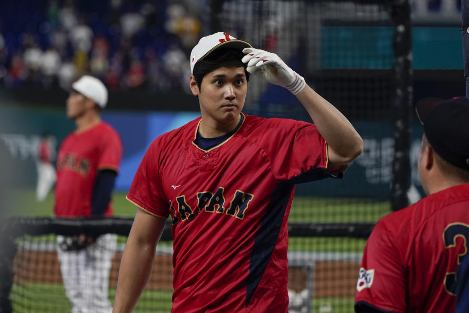 Japan player Shohei Ohtani warms up before the World Baseball Classic championship game against the United States, Tuesday, March 21, 2023, in Miami. (AP Photo/Wilfredo Lee)