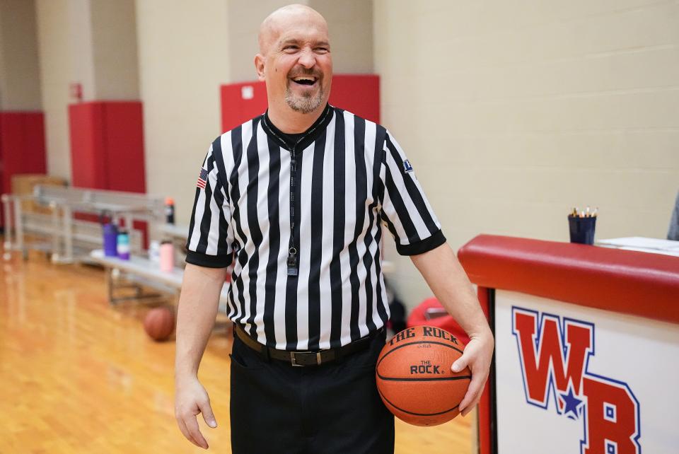 Scott Smith laughs with a fellow referee before the start of a girls basketball game Wednesday, Feb. 8, 2023 at Western Boone Junior High School in Thorntown. Smith is diagnosed with an aggressive form of stage 4 brain cancer. "I want people to see me and know that if you're diagnosed with something, it's OK," Smith said. "You can still live through it. You can still fight through it."