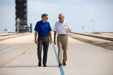 Astronaut Michael Collins speaks with NASA's John F. Kennedy Space Center Director Bob Cabana at Launch Pad 39A at the NASA's John F. Kennedy Space Center on the 50th anniversary of the launch of the Apollo 11 mission to the moon, in Cape Canaveral