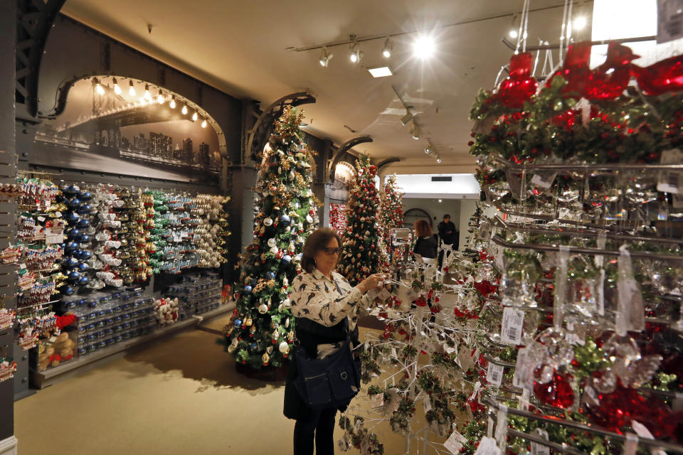 In this Tuesday, Nov. 5, 2019, photo shoppers browse the Holiday Lane section at the Macy's flagship store, in New York. With three weeks until the official start of the holiday shopping season, the nation’s retailers are gearing up for what will be another competitive shopping period. (AP Photo/Richard Drew)