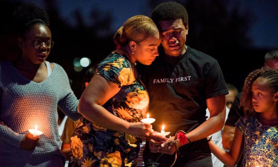 Veronica Hartfield, widow of Officer Charleston Hartfield, and family members attend a vigil at Police Memorial Park in Las Vegas.