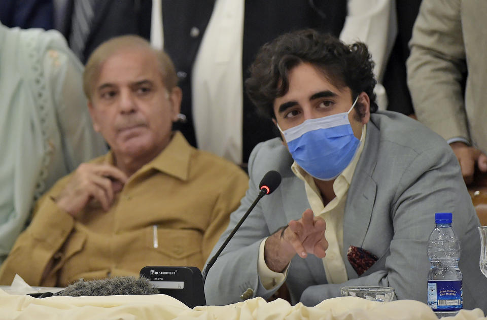 Pakistani opposition parties leaders Bilawal Bhutto Zardari, right, speaks while Shahbaz Sharif looks at a press briefing following their All Parties Conference, in Islamabad, Pakistan, Sunday, Sept. 20. 2020. Pakistani opposition parties demanded immediate resignation of Prime Minister Imran Khan and they launched an alliance to hold a countrywide protest movement against the government. (AP Photo/Anjum Naveed)