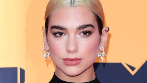 Dua Lipa's Rolling Stone Cover Includes a Barely-There Outfit & Tights –  Footwear News