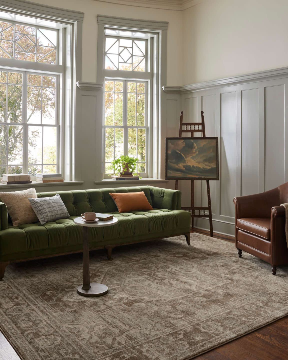 a living room with a green couch