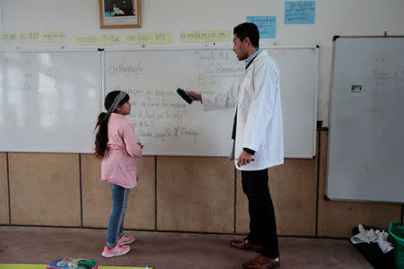 Moroccan teacher teaches French during a class in the Oudaya primary school in Rabat, Morocco January 31, 2019. Picture taken February 31, 2019. REUTERS/Youssef Boudlal