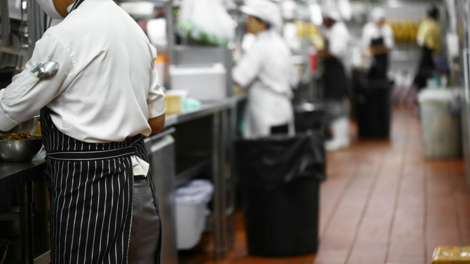 Blurred chef working in kitchen