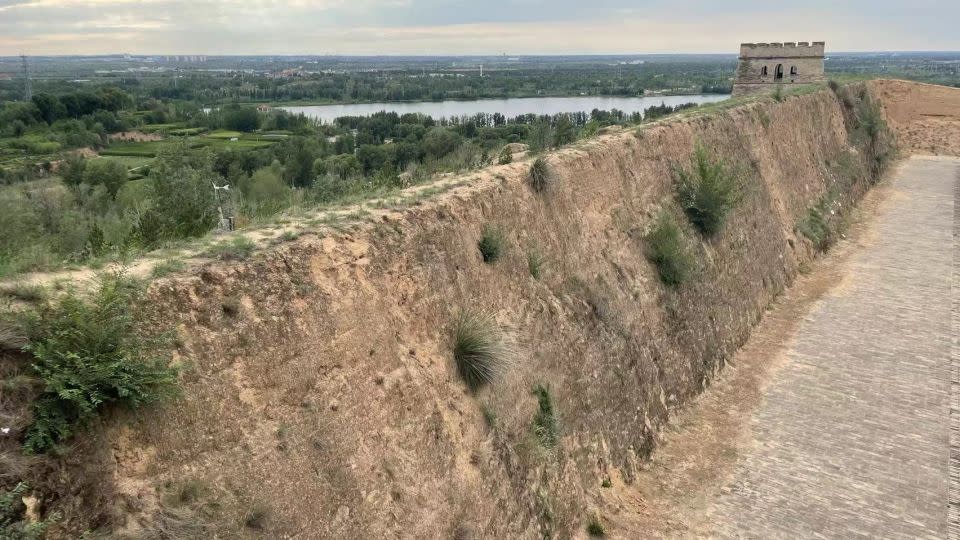 A “living skin” of tiny, rootless plants and microorganisms known as biocrusts cover the soil surfaces on the Great Wall of China. - Courtesy Bo Xiao