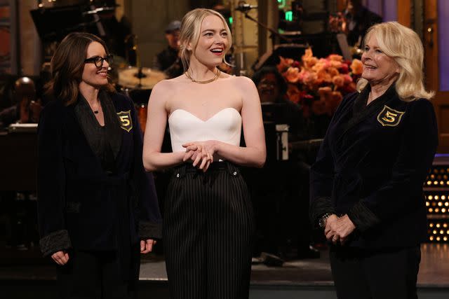 <p>Will Heath/NBC via Getty</p> Tina Fey and Candice Bergen welcome Emma Stone to 'SNL' Five-Timers Club