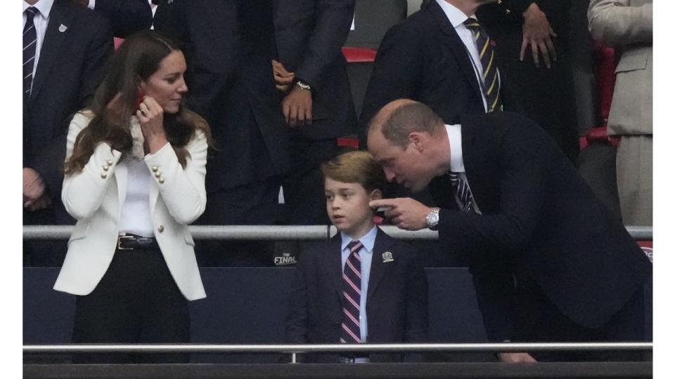 Kate Middleton, Prince George and Prince William at a football match