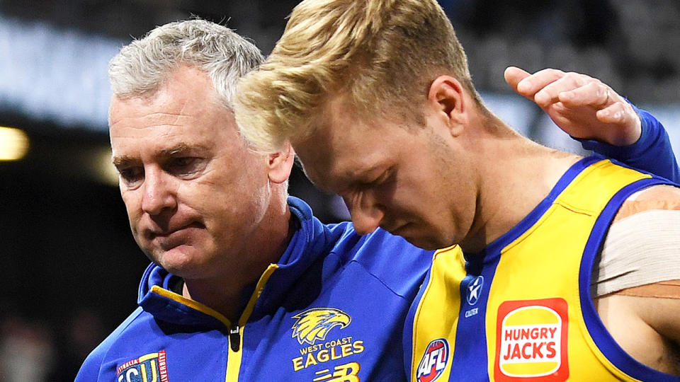 West Coast coach Adam Simpson puts an arm around Oscar Allen.