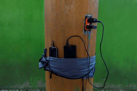 Mobile phones are seen at a migrant shelter, known as The 72, in Tenosique, Tabasco, Mexico, April 10, 2017. REUTERS/Carlos Jasso