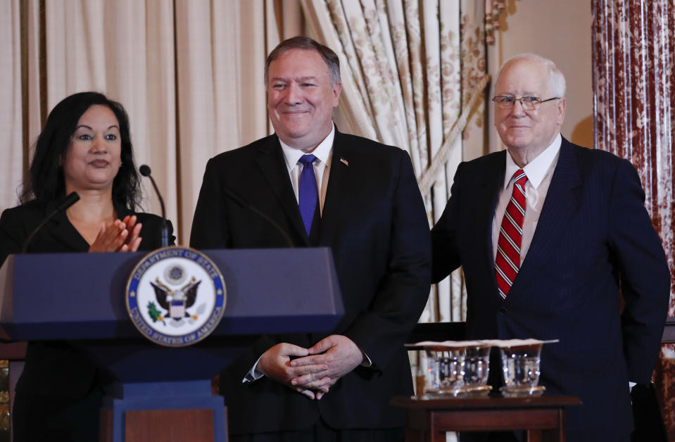 Secretary of State Mike Pompeo, center, with Assistant Secretary of State for Economic and Business Affairs Manisha Singh, left, and President of the World Food Prize Foundation and former U.S. Ambassador to Cambodia, Kenneth M. Quinn, right, pose during the announcement of the World Food Prize Laureate at the State Department, Monday, June 10, 2019. It was announced that Simon N. Groot of the Netherlands, founder of East-West Seed, will receive the 2019 World Food Prize. (AP Photo/Pablo Martinez Monsivais)