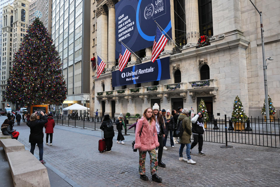 NEW YORK, NEW YORK - DECEMBER 21: People walk past the New York Stock Exchange during afternoon trading on December 21, 2022 in New York City.  Stocks closed strong today for a second straight day with the Dow Jones closing over 500 points amid a better-than-expected Conference Board consumer confidence report.  (Photo by Michael M. Santiago/Getty Images)