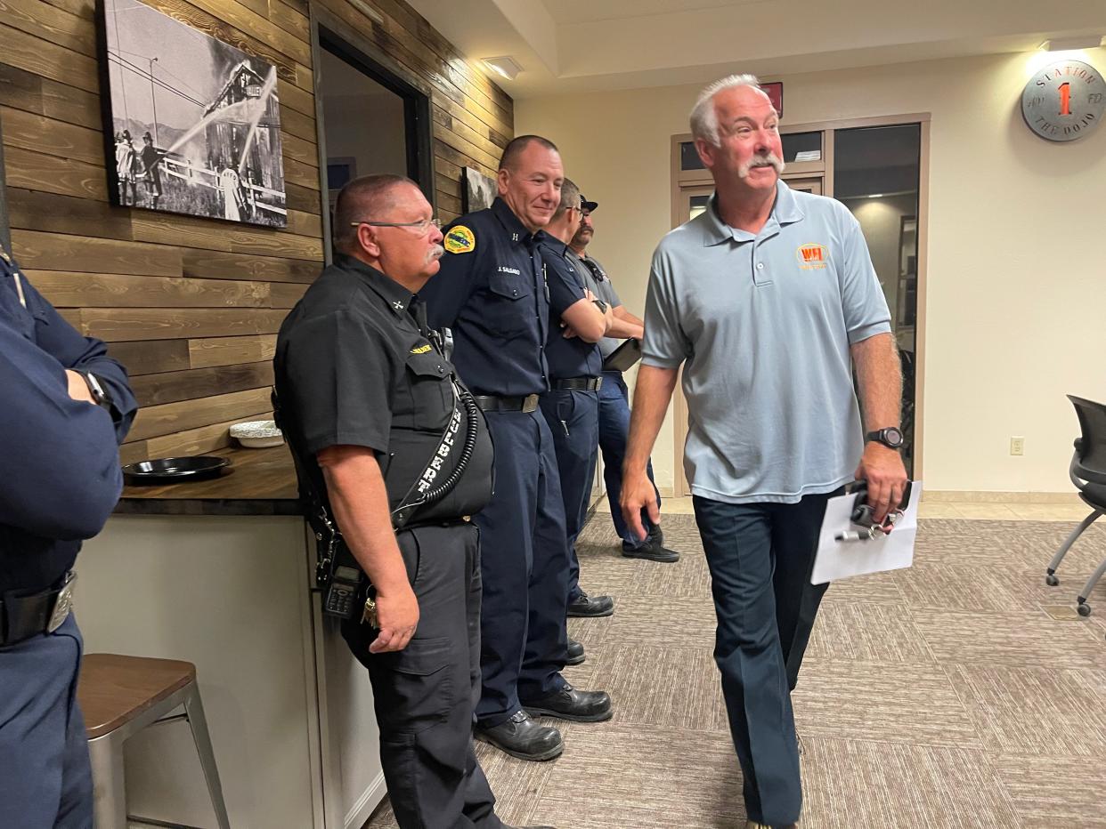 With his resignation agreement in hand, Fire Chief Ken Harrison on Wednesday night bid farewell to his colleagues before leaving the special board meeting of the Apple Valley Fire Protection District.