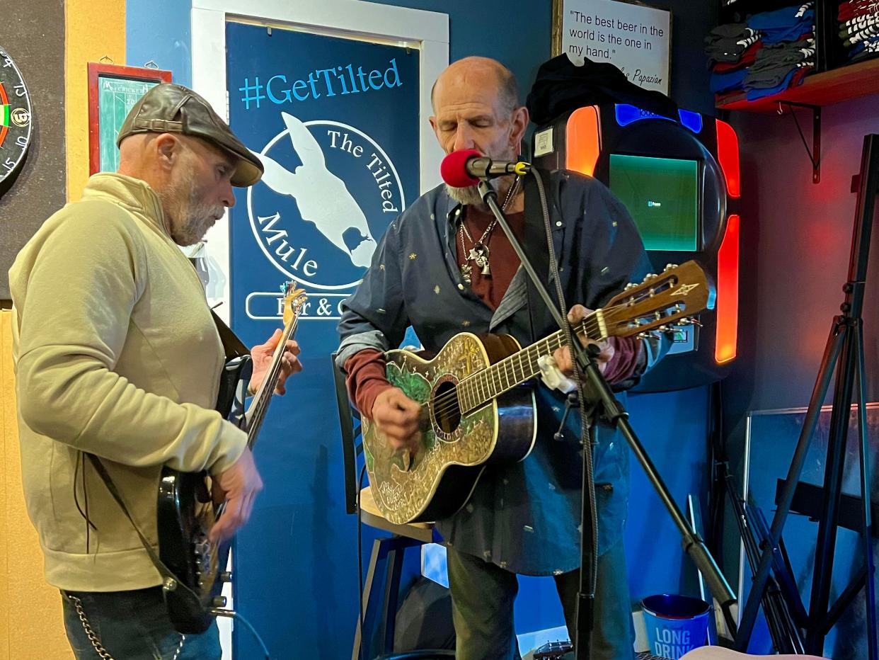 Womack & Virgin, with Mickey Womack, right, and Bob Virgin, close out the monthly Stop 22 veterans open mic at The Tilted Mule on Tuesday, Feb. 13, 2024.