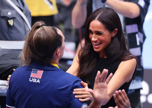 <p>Joern Pollex/Getty</p> Meghan Markle attends the Mixed Team Wheelchair Basketball Medal Ceremony at the 2023 Invictus Games.