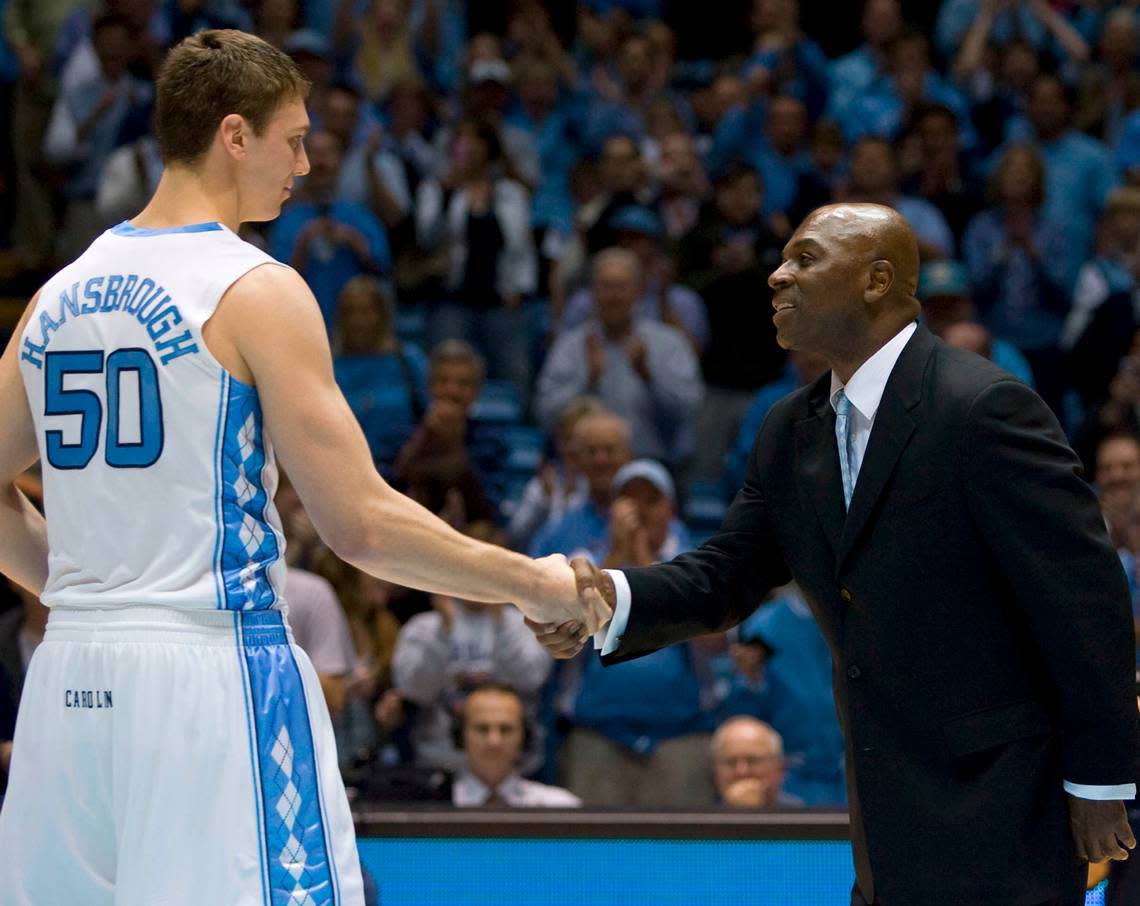 Tar Heel great Phil Ford, congratulates Tyler Hansbrough (50) after he broke Ford’s record for the most points scored in his career, after Hansbrough scored 20 points to lead the Tar Heels to a 91-73 victory over Evansvilleon Thursday on December 18, 2008 in the Smith Center. Staff photo by Robert Willett/The News & Observer