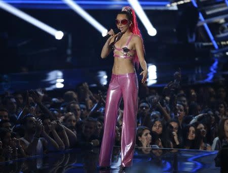 Show host Miley Cyrus speaks on stage at the 2015 MTV Video Music Awards in Los Angeles, California August 30, 2015. REUTERS/Mario Anzuoni