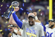 Los Angeles Rams outside linebacker Von Miller holds up the Lombardi Trophy after the Rams defeated the Cincinnati Bengals in the NFL Super Bowl 56 football game Sunday, Feb. 13, 2022, in Inglewood, Calif. (AP Photo/Chris O'Meara)