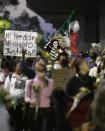 People march demanding justice for the people who died in Monday's subway collapse, in Mexico City's south side, Friday, May 7, 2021. An elevated section of Line 12 collapsed late Monday killing at least 25 people and injuring more than 70, city officials said. (AP Photo/Eduardo Verdugo)