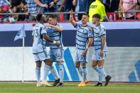 Sporting Kansas City midfielder Erik Thommy (26) celebrates a goal with teammates in the first half during a MLS game against Inter Miami at GEHA Field at Arrowhead Stadium on Saturday, April 13, 2024, in Kansas City.