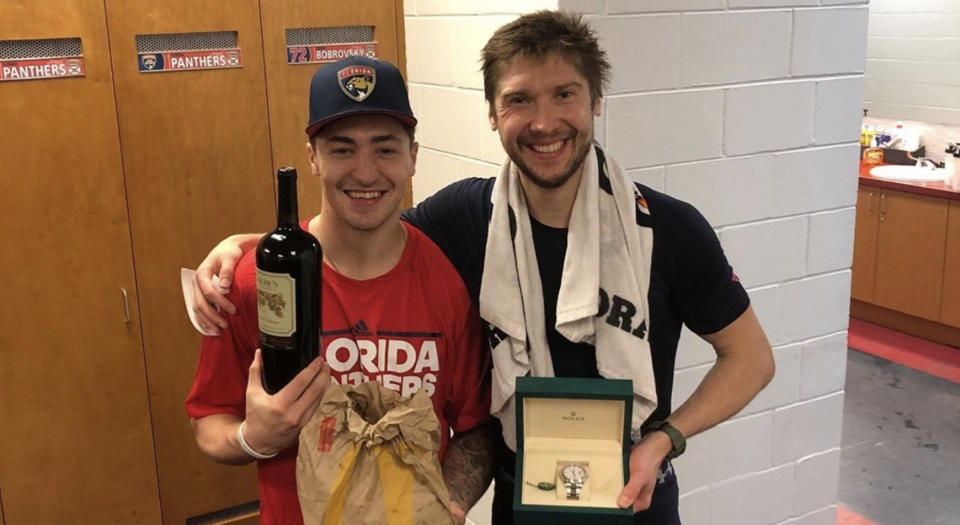 Florida Panthers teammates Frank Vatrano (left) poses with Sergei Bobrovsky (right) and the gifts he received from the Russian goaltender after giving up his number. (Instagram//@frank_vatrano)