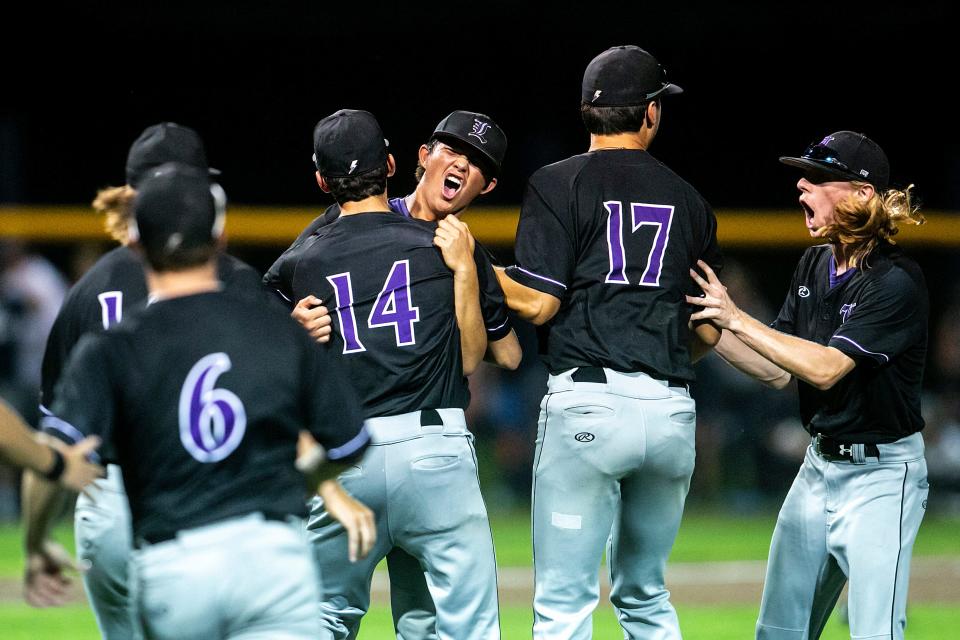 Iowa City Liberty pitcher Jackson Khamphilanouvong is embraced by teammates as they celebrate after a Class 4A baseball substate final against Pleasant Valley, Wednesday, July 13, 2022, in Riverdale, Iowa. The Lightning beat the Spartans, 5-4, and advance to the state tournament next week in Iowa City.