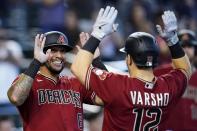 Arizona Diamondbacks' Daulton Varsho (12) celebrates his three-run home run against the Detroit Tigers with Diamondbacks' David Peralta (6) during the sixth inning of a baseball game Sunday, June 26, 2022, in Phoenix. (AP Photo/Ross D. Franklin)