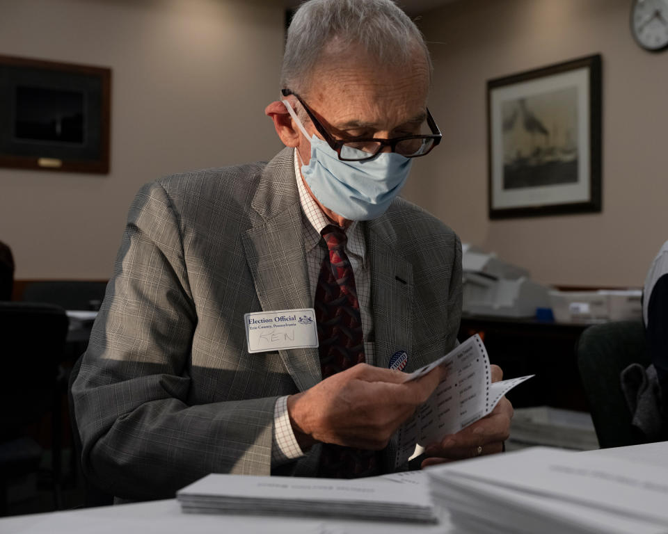 Ken Weber, a Pennsylvanian election official, validating votes. All ballots arriving after 8 p.m. on Nov. 3 were segregated<span class="copyright">Lorenzo Meloni—Magnum Photos for TIME</span>