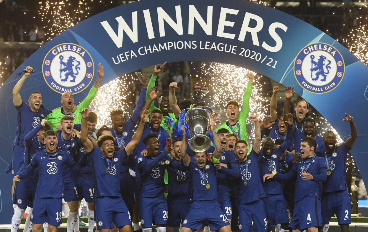 Chelsea players celebrate with the trophy after winning the Champions League. 