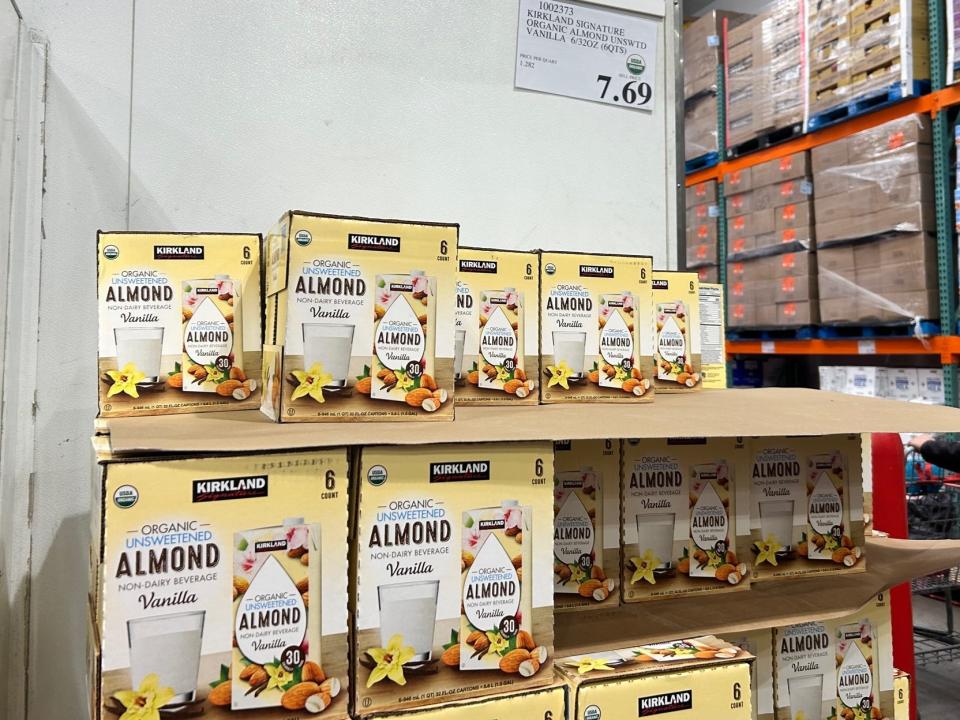 boxes of almond milk stacked up at Costco