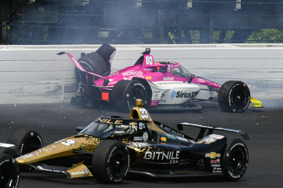 Simon Pagenaud, of France, hits the wall in the third turn during the Indianapolis 500 auto race at Indianapolis Motor Speedway in Indianapolis, Sunday, May 28, 2023. (AP Photo/James Miller)