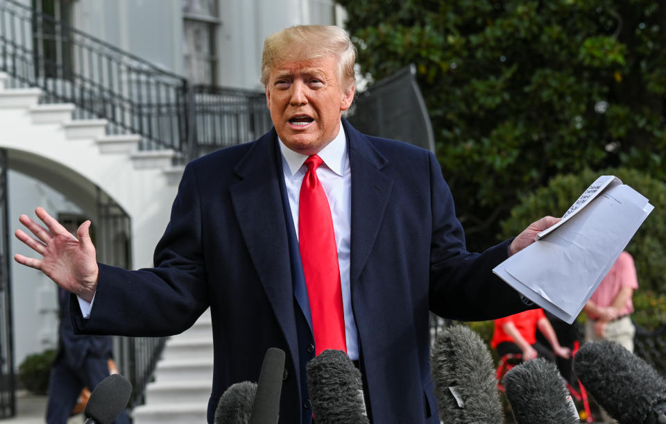 President Donald Trump holds what appears to be a prepared statement and handwritten notes after watching testimony by U.S. Ambassador to the European Union Gordon Sondland at House Intelligence Committee impeachment hearings, as he speaks to reporters prior to departing for travel to Austin, Texas from the South Lawn of the White House in Washington, U.S., November 20, 2019. (Photo: Erin Scott/Reuters)